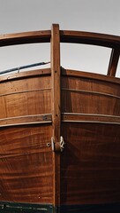 classic wooden boat facing the camera, minimalist, deadpan, banal, cool, clinical, urban, iconic, conceptual, subversive, sparse, restrained, symbol vertical