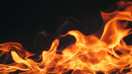 Fototapeta premium Dancing Fire: Fiery Flames Against a Black Background