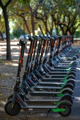 Energy Efficient Transportation: Row of Electric Scooters in a Green City Park