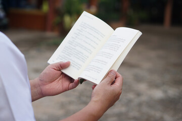 Close up man is reading book. Concept, self study, reading book for knowledge, pleasure or self...