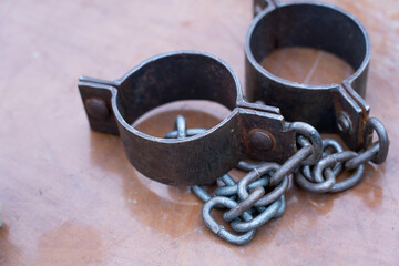 Ancient iron shackles of a slave with a chain