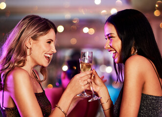 Excited, women and toast with champagne at nightclub for birthday celebration, social reunion or luxury party. Smile, friends and alcohol cheers for new years, festival congratulations and happy hour