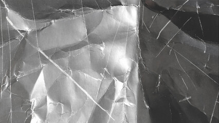 black cardboard texture with scuffs and scratches, wrinkled
