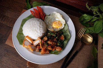 Thai food Crispy pork with basil and fried eggs