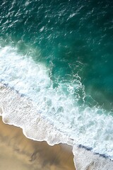 Aerial View of Waves Crashing on a Sandy Beach