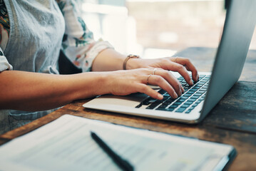 Cafe, typing and hands of person, laptop and inventory of order, stock or monitor of sales and writing. Small business, entrepreneur and track of attendance, schedule or fill vacancies in coffee shop