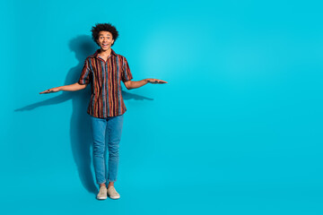 Full body portrait of nice young man measure empty space wear shirt isolated on turquoise color background