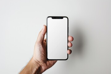 Hand Holding Smartphone with Blank Screen for Design Mockup and User Interface Concepts