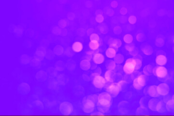 Pink blurred lights on violet backdrop, bokeh effect. Halloween background