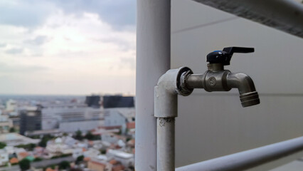 Close up view of outdoor water faucet