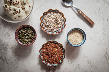 Seed cycling for hormonal balance - flax, pumpkin, sunflower and sesame seeds for different phases of menstrual cycle, women's health