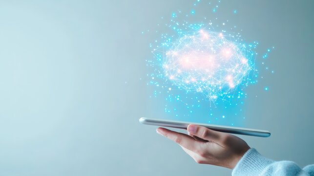 Person holding tablet with glowing digital brain hologram, representing AI and technology.