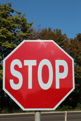 A stop sign is posted on a pole