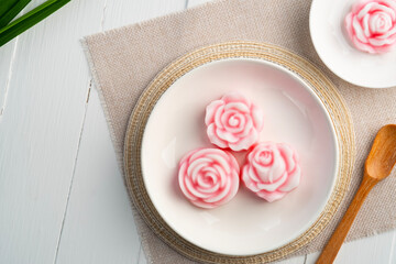 Coconut Milk Jelly (Thai Dessert).fancy rose shaped jelly in white plate .( Wun Kati).Top view.