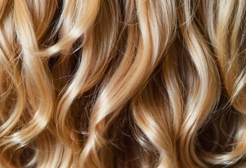 Fototapeta premium Soft, luminous curls frame the face, highlighting the vibrant and healthy texture of the blond hair. The close-up captures the intricate details beautifully. Care cosmetics. Generative AI