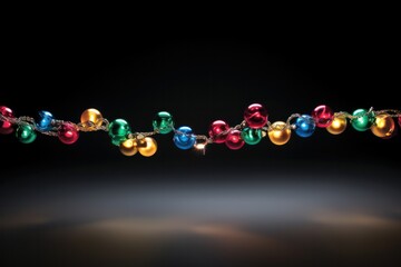 A festive string of Christmas lights, adorned with ornaments and tinsel, spreading holiday cheer against