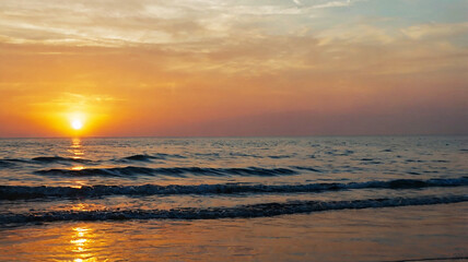 Fototapeta premium Blurred bokeh of a sunrise over a calm ocean