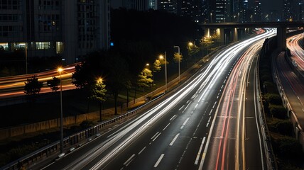 Night cityscape with busy highway traffic.