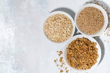 range of products made from oats on white background, top view