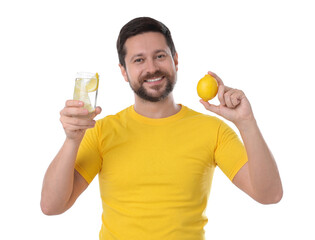 Fototapeta premium Happy man holding glass of water with lemon on white background