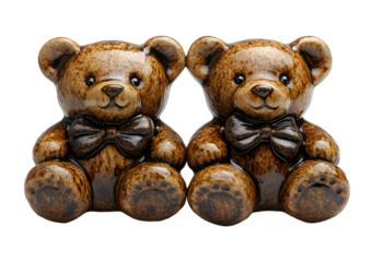 two ceramic teddy bears sitting together. 