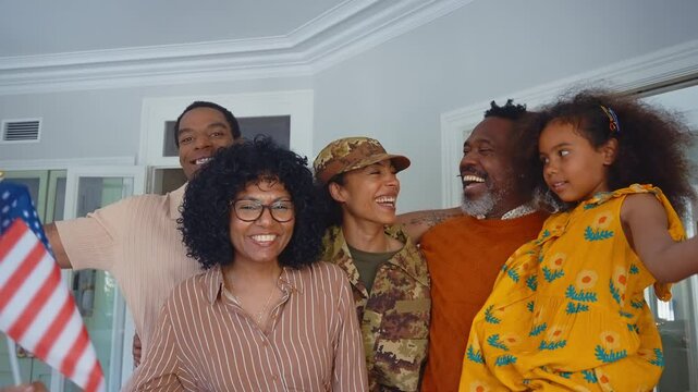 Cinematic video of a woman coming back home from the army military service in the us. Family reunited at lunch time indoor in a beautiful american house.