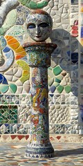 Mosaic Column with Human Head Statue in Colorful Background
