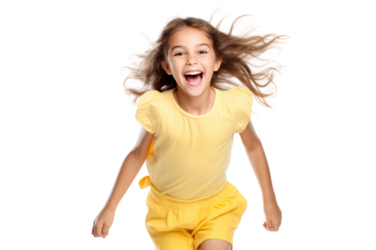 A cheerful little girl with pigtails, laughing and jumping in the air, dressed in a playful summer outfit isolated on white background