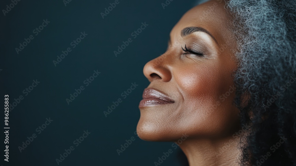 Poster a close-up portrait with a blurred face set against a dark gradient background, creating a mysteriou