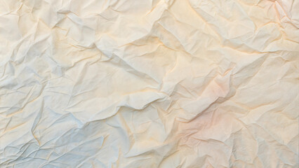 Wrinkled textured light paper background with soft colors and folds copy space