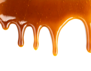 Flüssiges Karamell von oberen Rand laufend isoliert auf weißen Hintergrund, Freisteller