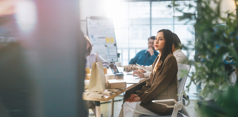 Business asian woman sitting in office meeting presentation ESG and technology innovations recycle...
