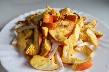 Amanita caesarea mushroom cut into pieces on a plate