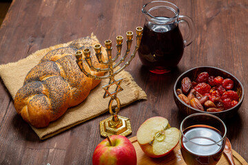 Challah, honey, apple and pomegranate and wine for the Rosh Hashanah holiday