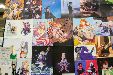 Fototapeta premium Toronto, Down Toune, On, Canada - Marth 18th, 2024: Display booths featuring comic books, art, and t-shirts at Planet Comicon. High quality photo