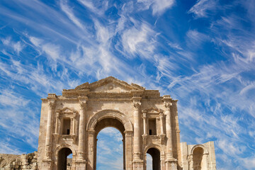 Arch of Hadrian in Gerasa (Jerash)-- was built to honor the visit of emperor Hadrian to Jerash in 129/130 AD, Jordan. Against the background of a beautiful sky with clouds