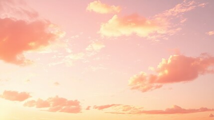 Pastel pink and orange sky during the golden hour, with light clouds scattered across