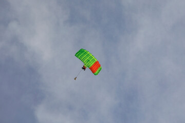 Tandem paraglider pilots with a slightly cloudy sky in Illertissen