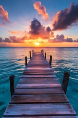 Obraz premium Wooden Dock Extending into the Ocean at Sunset