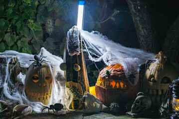 Unusual original Halloween composition, scary Jack O Lantern Halloween pumpkins in the dark