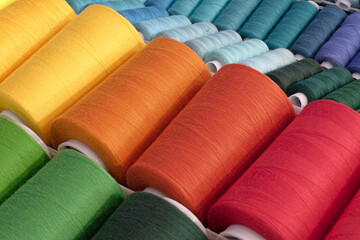 Spools of multi-coloured cotton threads