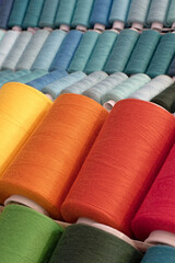 Spools of multi-coloured cotton threads