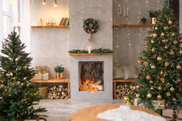 The interior of the Scandinavian-style living room, decorated for the Christmas holidays. Christmas tree next to the fireplace.