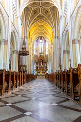 Grand Gothic cathedral interior with intricate altar and arched ceilings