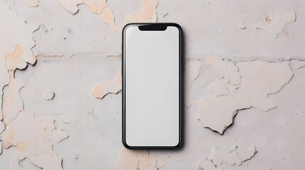 A smartphone with a blank screen is displayed against a textured, peeling wall background, emphasizing minimalism and modern technology.