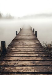 Obraz premium Wooden Dock Leading Into Foggy Lake