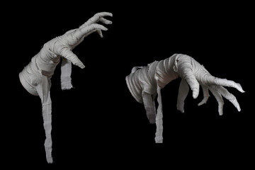 Mummy's hands wrapped in a bandage creepily moving on isolated background. The hand of the mummy...