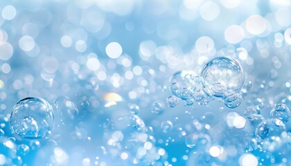 A vibrant close-up of transparent bubbles floating in a blue, watery background with soft light reflections and bokeh effect.


