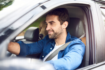 Man, happy and dog in car for road trip, travel and holiday with bonding, connection and driving. Male person, smile and golden retriever in van for pet care, vacation and break on weekend with puppy