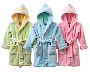 Three cozy robes in pastel colors, designed for children. The green, blue and pink robes have hoods, pockets and belts, all on a white background.
